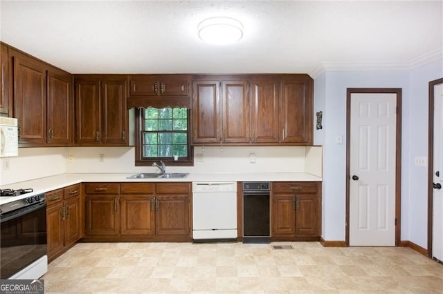 kitchen featuring a sink, white appliances, crown molding, light countertops, and baseboards