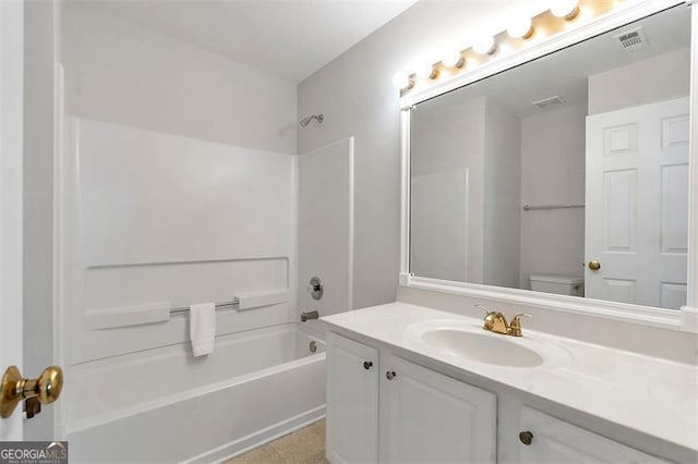 full bathroom featuring tub / shower combination, visible vents, toilet, and vanity