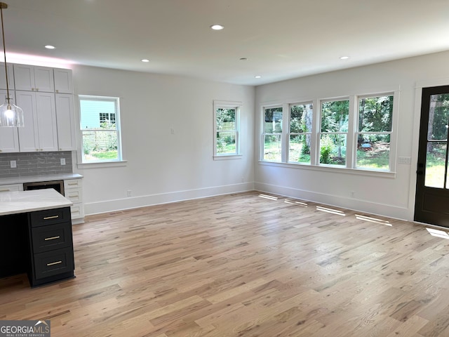 2611 Charlesgate Ave, Decatur, GA 30030 - kitchen featuring light wood finished floors, baseboards, plenty of natural light, recessed lighting, and pendant lighting
