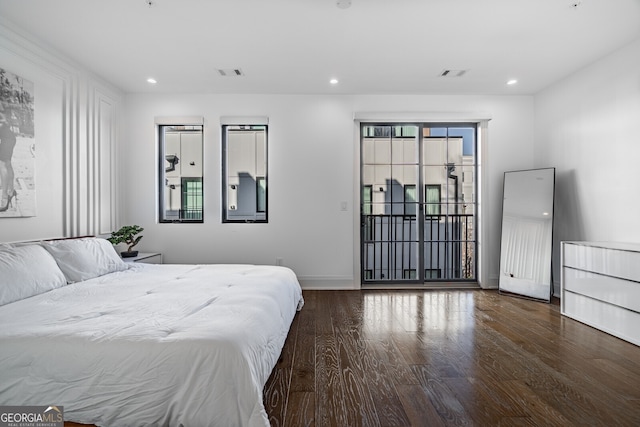 bedroom featuring baseboards, visible vents, recessed lighting, wood finished floors, and access to outside