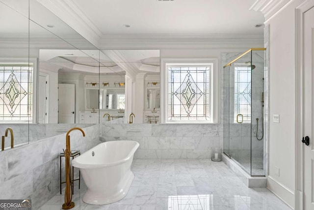 bathroom with crown molding, plenty of natural light, and a shower stall