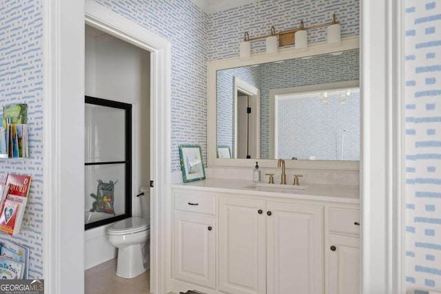 bathroom featuring tile patterned floors, toilet, and vanity