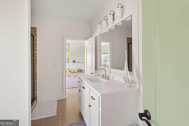 bathroom with tile patterned floors, vanity, and a shower with door