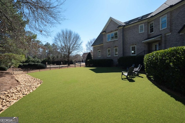 view of yard featuring fence