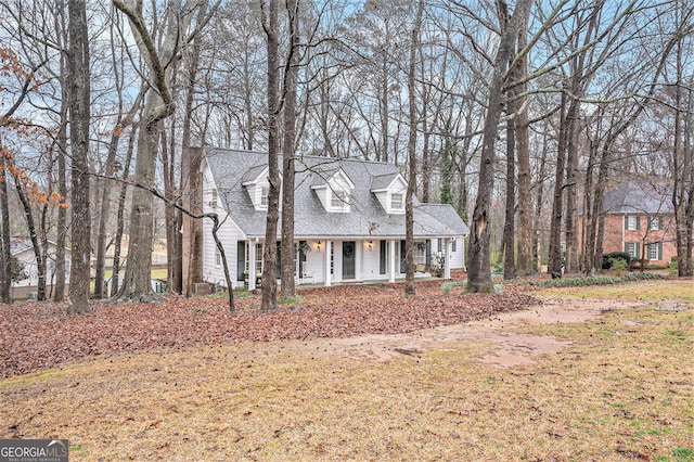 cape cod house with a porch