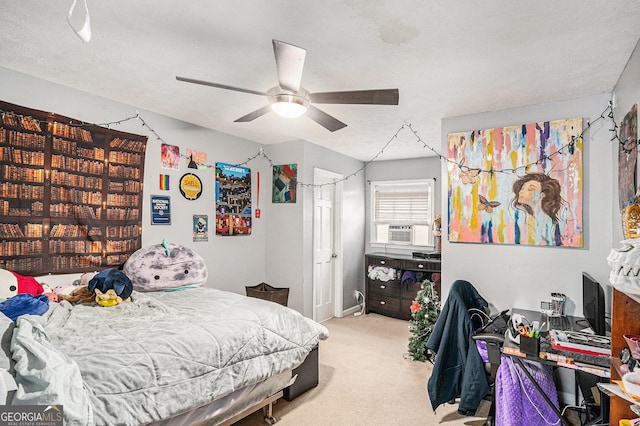 bedroom with cooling unit, light colored carpet, and ceiling fan