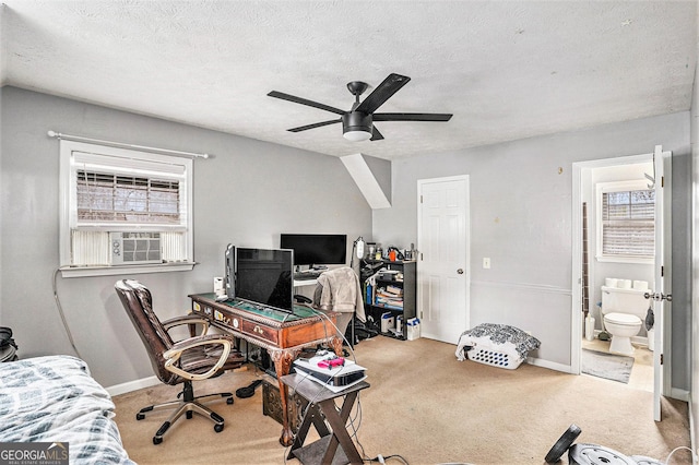 home office featuring cooling unit, a ceiling fan, baseboards, a textured ceiling, and carpet flooring