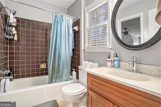 full bath featuring vanity, shower / bath combination with curtain, and toilet