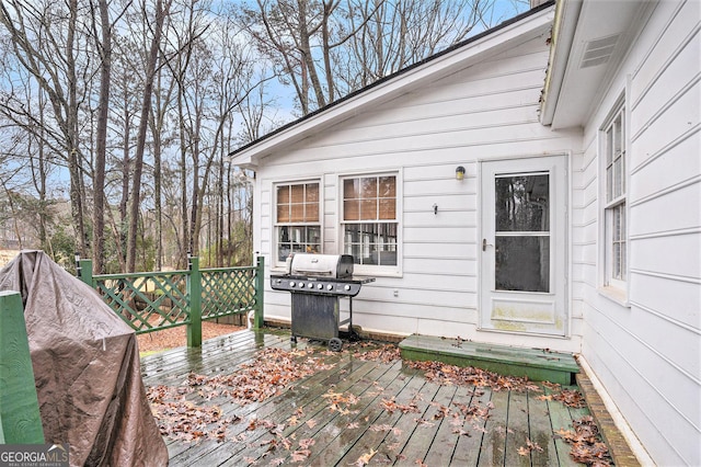 wooden deck with area for grilling