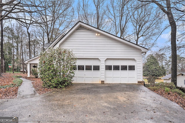 view of side of property with a garage