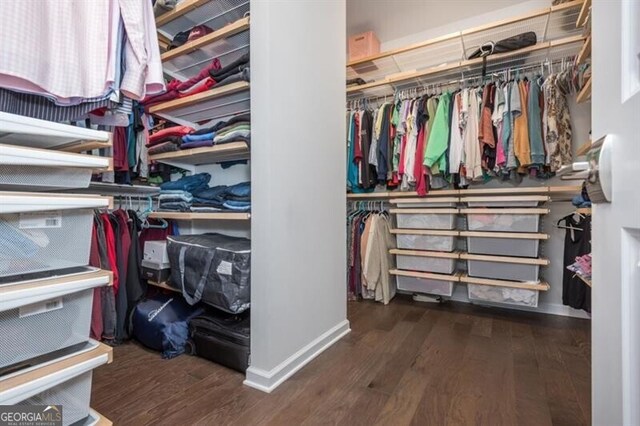 385 Rowes Cir, Alpharetta, GA 30009 - walk in closet featuring wood finished floors