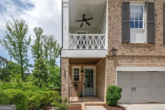 385 Rowes Cir, Alpharetta, GA 30009 - view of exterior entry featuring a balcony, an attached garage, brick siding, driveway, and a ceiling fan