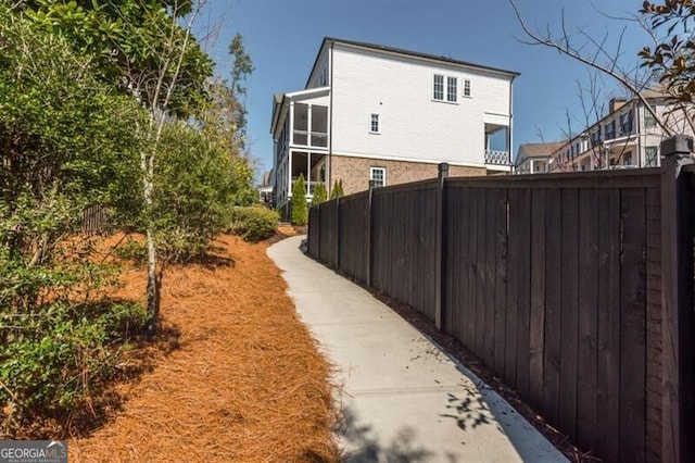 385 Rowes Cir, Alpharetta, GA 30009 - view of home's exterior with fence and stucco siding