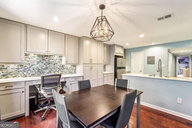 dining room featuring dark wood finished floors, visible vents, recessed lighting, and baseboards