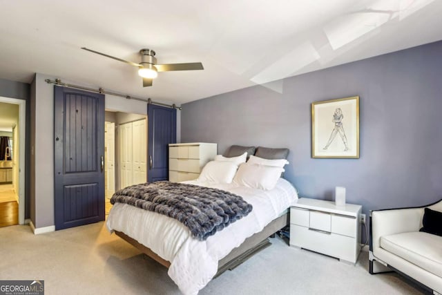 bedroom featuring a ceiling fan, a closet, carpet floors, and baseboards