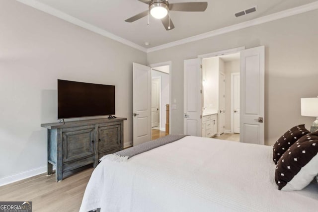 bedroom featuring light wood-type flooring, visible vents, a ceiling fan, crown molding, and baseboards