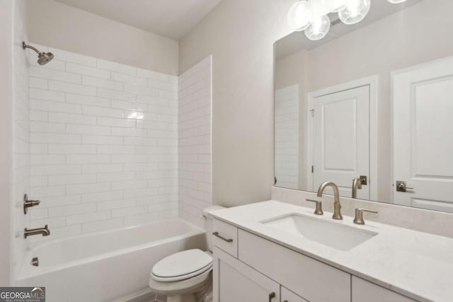 bathroom featuring vanity, toilet, and tub / shower combination