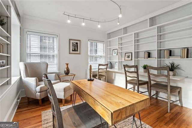 office with crown molding, rail lighting, and wood finished floors