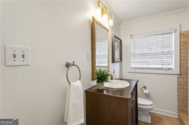 full bathroom with vanity, tile patterned floors, toilet, and ornamental molding