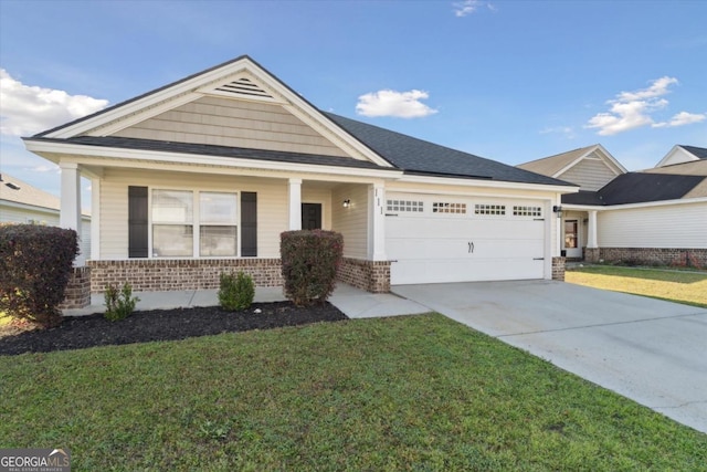 view of front of house featuring brick siding, driveway, a front lawn, and a garage