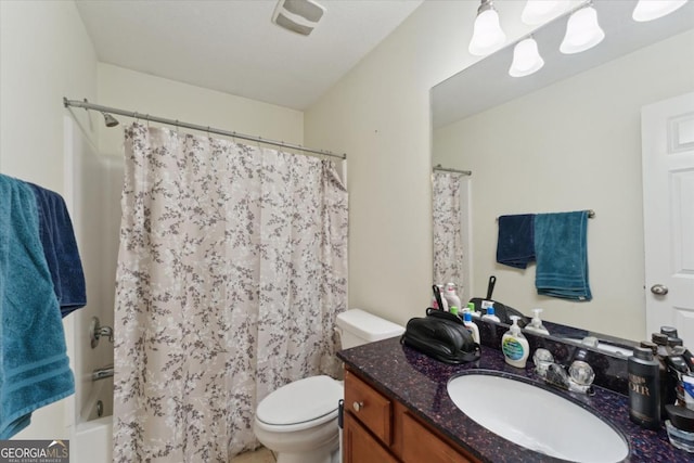 bathroom featuring shower / bath combo with shower curtain, visible vents, toilet, and vanity