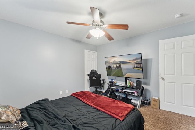 bedroom featuring a ceiling fan and carpet