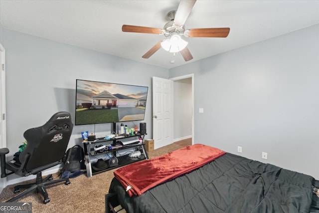 bedroom with a ceiling fan and carpet flooring