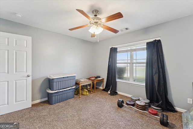 rec room with carpet, a ceiling fan, visible vents, and baseboards