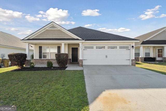 view of front of property with a front yard, an attached garage, brick siding, and driveway