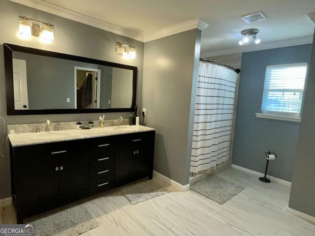 full bath featuring visible vents, baseboards, double vanity, ornamental molding, and a sink