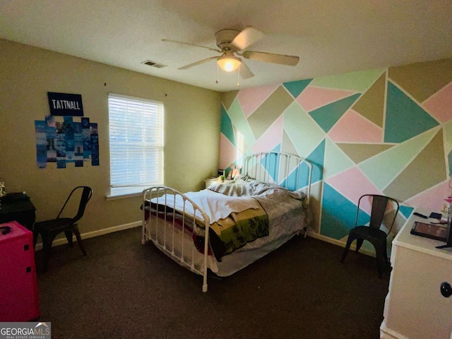 bedroom with visible vents, baseboards, carpet floors, and ceiling fan