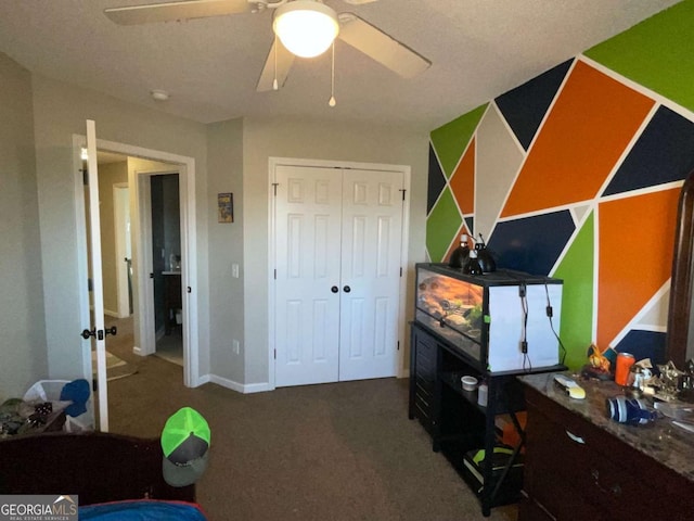 carpeted bedroom featuring baseboards, a closet, and ceiling fan