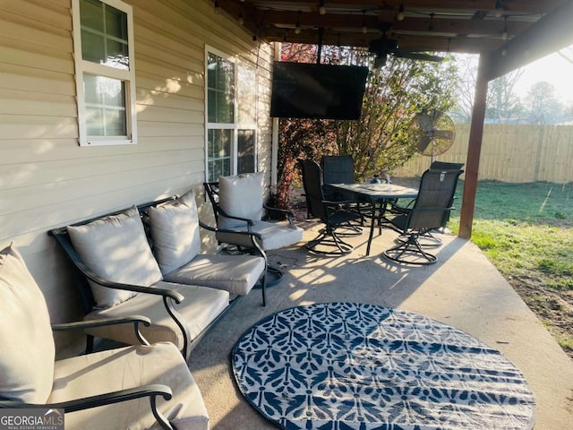 view of patio / terrace with outdoor dining area and fence