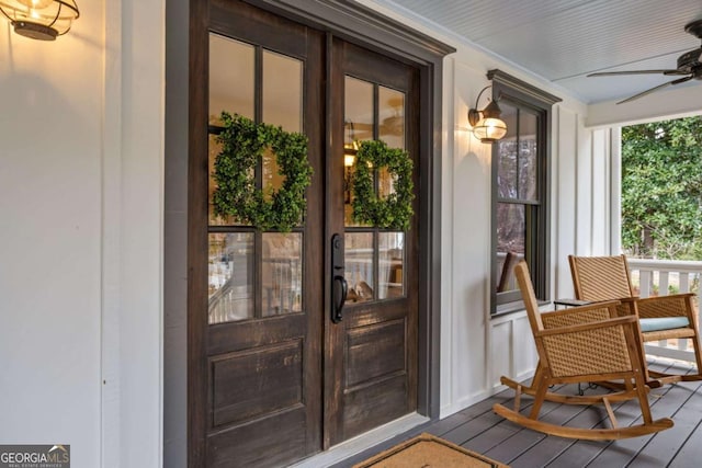 4770 Hilltop Dr NW, Acworth, GA 30101 - entrance to property featuring french doors, a ceiling fan, and covered porch