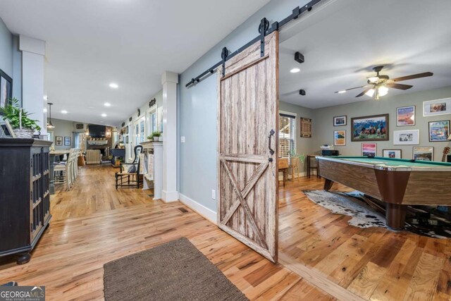 4770 Hilltop Dr NW, Acworth, GA 30101 - recreation room with a barn door, light wood-style flooring, billiards, healthy amount of natural light, and recessed lighting