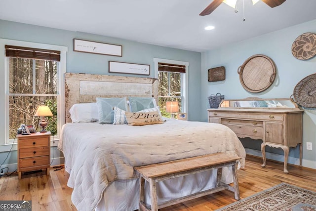 4770 Hilltop Dr NW, Acworth, GA 30101 - bedroom featuring wood-type flooring, multiple windows, a ceiling fan, and recessed lighting