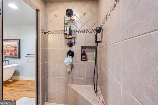 4770 Hilltop Dr NW, Acworth, GA 30101 - full bath with wood finished floors, tiled shower, and a freestanding bath