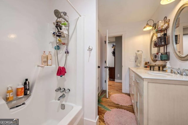 4770 Hilltop Dr NW, Acworth, GA 30101 - full bath featuring vanity, wood finished floors, and shower / washtub combination