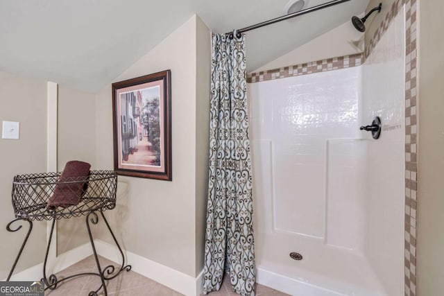 4770 Hilltop Dr NW, Acworth, GA 30101 - bathroom featuring lofted ceiling, a shower with shower curtain, and tile patterned flooring