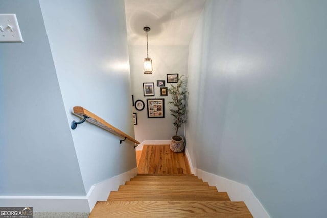 4770 Hilltop Dr NW, Acworth, GA 30101 - stairway featuring baseboards and wood finished floors