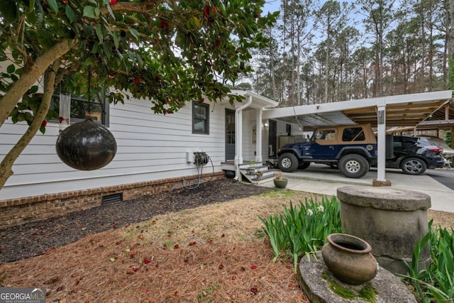 4770 Hilltop Dr NW, Acworth, GA 30101 - view of home's exterior featuring crawl space and a carport