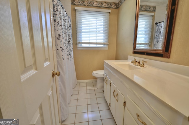 bathroom with tile patterned floors, baseboards, toilet, and vanity