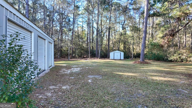 view of yard featuring an outbuilding and a storage shed