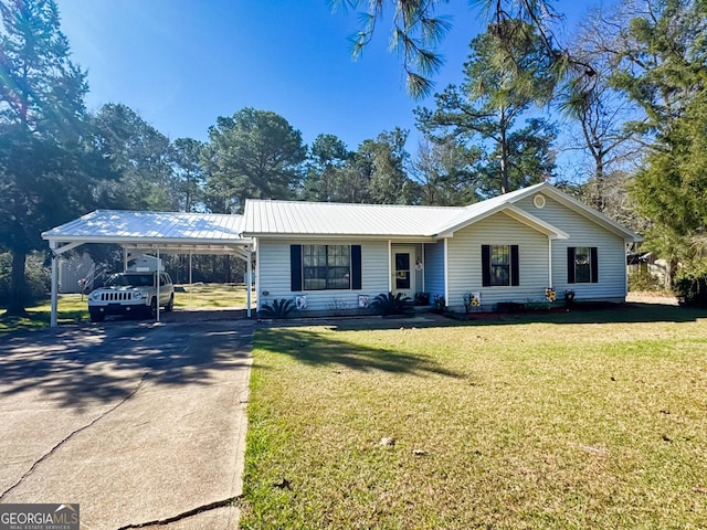 view of front of house featuring a front yard, a carport, driveway, and metal roof