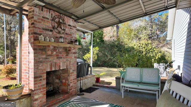 view of patio / terrace with ceiling fan, an outdoor brick fireplace, and grilling area