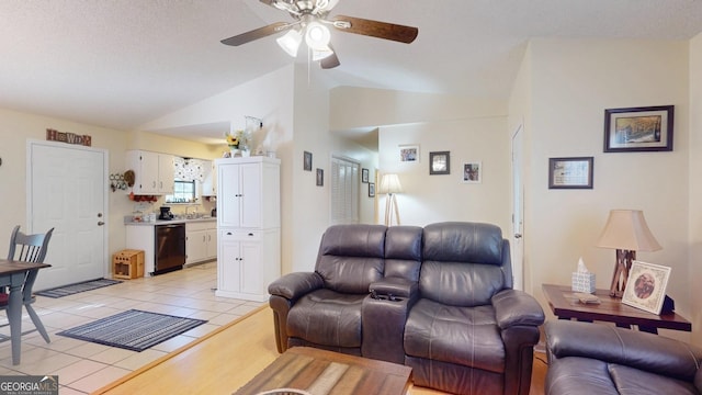 living area featuring light tile patterned floors, ceiling fan, and lofted ceiling