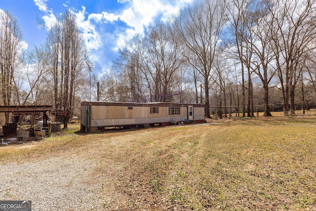 exterior space featuring a front lawn