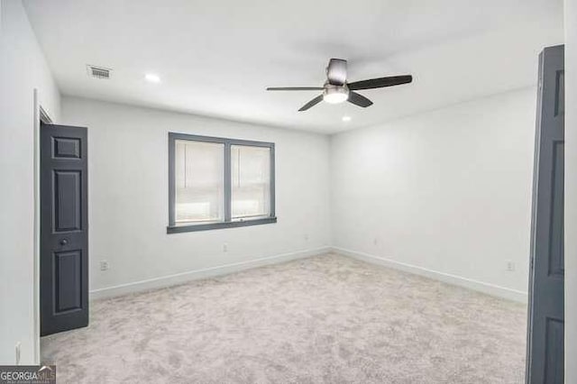 carpeted empty room with recessed lighting, visible vents, baseboards, and ceiling fan