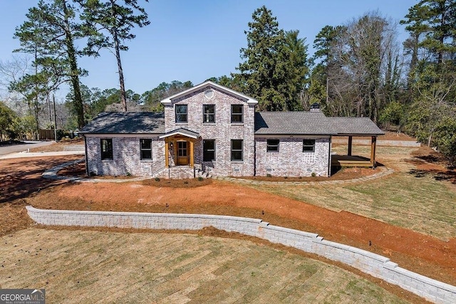 view of front facade with stone siding, a chimney, and a front lawn