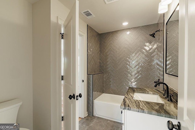 bathroom featuring shower / bath combination, visible vents, toilet, and vanity